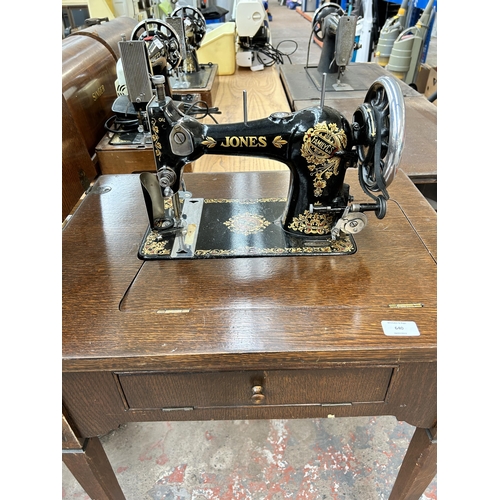 640 - A vintage sewing machine table fitted with Jones Family C.S. Sewing Machine