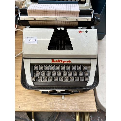 651 - Two cased portable typewriters, one Lilliput and one boxed Litton Imperial with instruction manual a... 