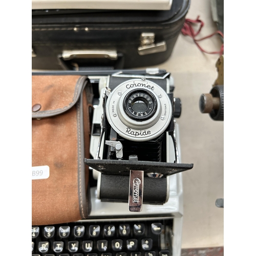 654 - Two items, one Silver-Leed SR100 tabulator portable typewriter and one cased Coronet Rapide folding ... 