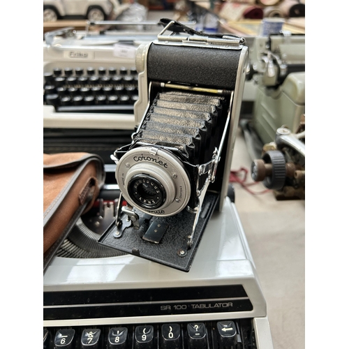 654 - Two items, one Silver-Leed SR100 tabulator portable typewriter and one cased Coronet Rapide folding ... 