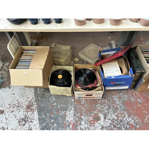 921 - Ten boxes containing a large collection of vinyl records, CDs and cassette tapes