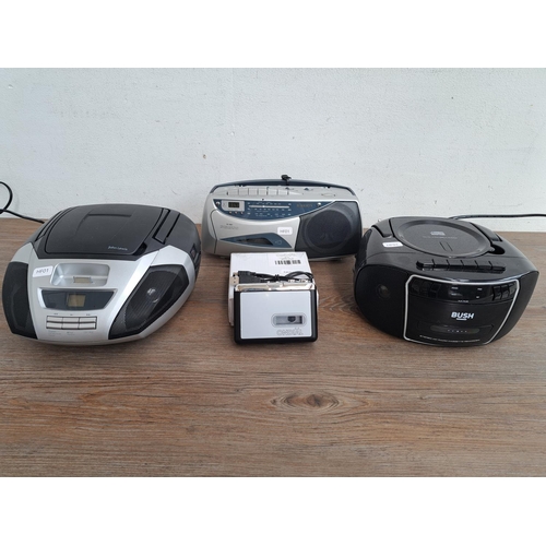 518 - Four items, one Roberts RC9907 radio/alarm clock/cassette recorder, one Bush CD player/radio/cassett... 