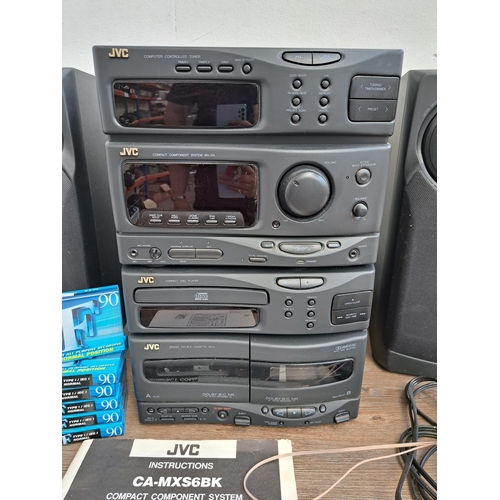 534 - A JVC MX-S6 compact stereo system with cables, remote control, instruction manual, sealed blank cass... 