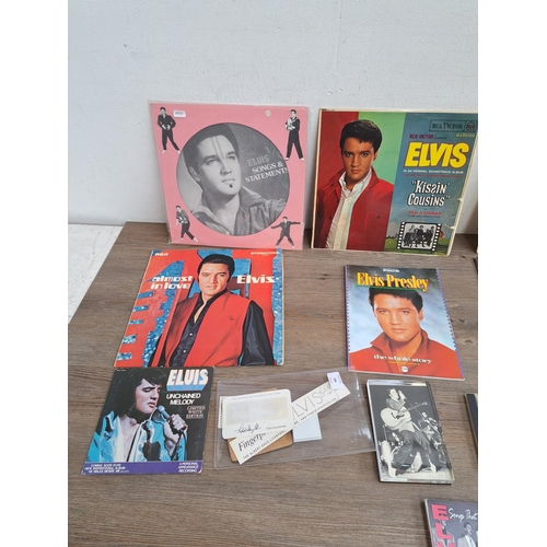 564 - A collection of Elvis Presley memorabilia to include badges, fan club membership pass, coaster, unch... 