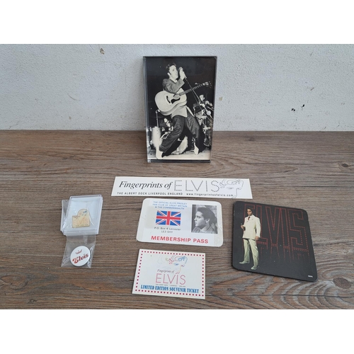 564 - A collection of Elvis Presley memorabilia to include badges, fan club membership pass, coaster, unch... 