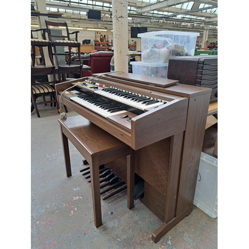 568A - A Yamaha Electone A-55N electric organ with stool