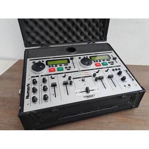 569 - A collection of DJ equipment to include cased Numark CD Mix 2 professional CD mixing console, cased ... 