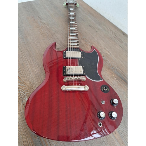 571 - An Epiphone SG electric guitar