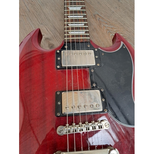 571 - An Epiphone SG electric guitar