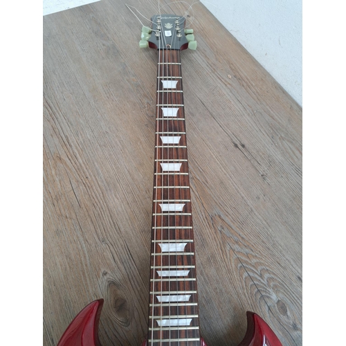 571 - An Epiphone SG electric guitar