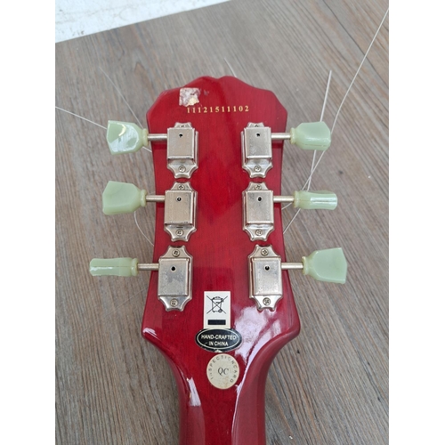 571 - An Epiphone SG electric guitar