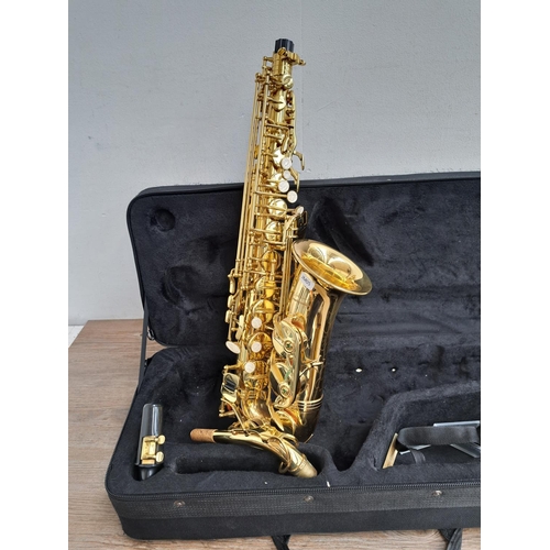 572 - A cased Vincent Bach International Elkhart alto saxophone with mouthpiece and strap