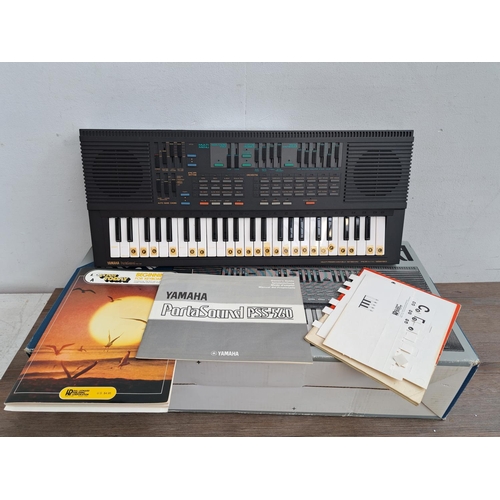 573 - A boxed mid 1980s Yamaha PSS-560 PortaSound digital synthesizer electronic keyboard with instruction... 