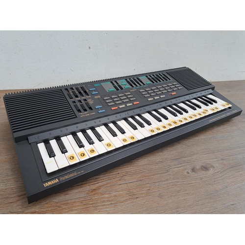 573 - A boxed mid 1980s Yamaha PSS-560 PortaSound digital synthesizer electronic keyboard with instruction... 