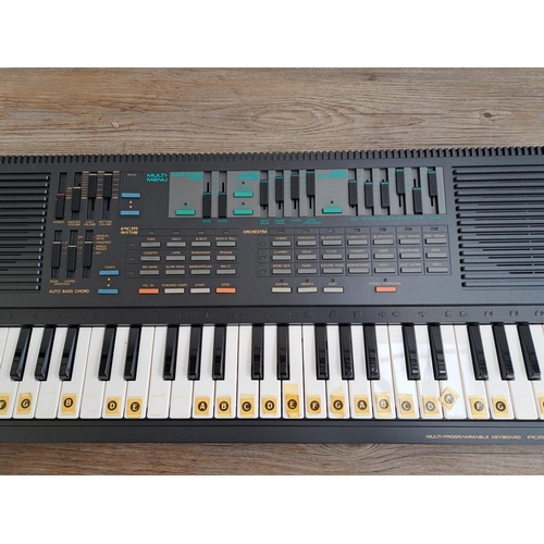 573 - A boxed mid 1980s Yamaha PSS-560 PortaSound digital synthesizer electronic keyboard with instruction... 