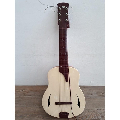 575 - A  boxed vintage Selcol 1005 plastic child's steel strung guitar (scale length 43cm)