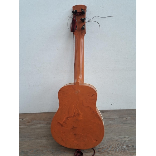 575 - A  boxed vintage Selcol 1005 plastic child's steel strung guitar (scale length 43cm)