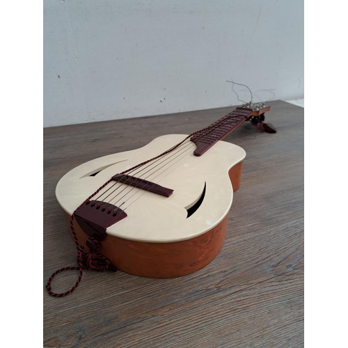 575 - A  boxed vintage Selcol 1005 plastic child's steel strung guitar (scale length 43cm)