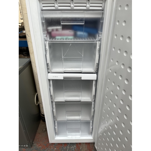 665 - A Beko A class upright freezer - approx. 145cm high