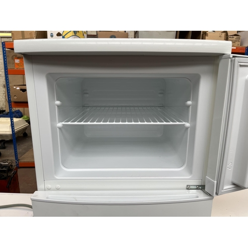 670 - A Zanussi upright fridge/freezer - approx. 159cm high