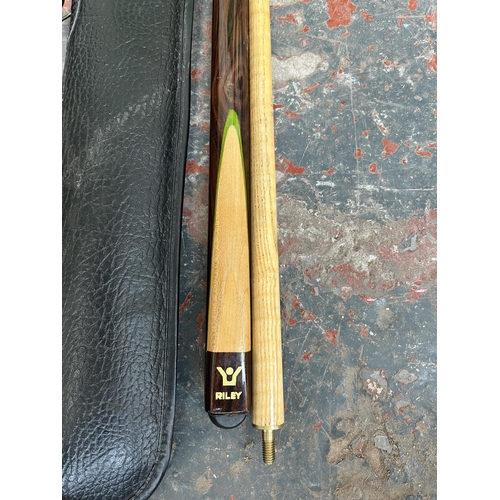 684A - A cased Riley two-piece Signature Series Snooker cue