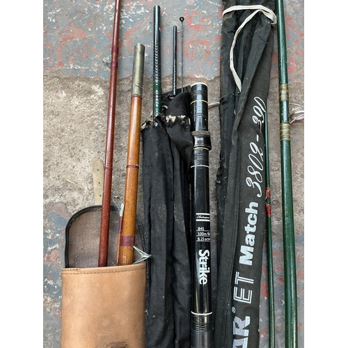 705 - Five pieces of fishing equipment, four vintage rods and one telescopic triangular net