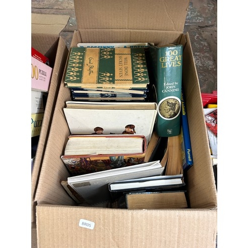 915 - Four boxes and two vintage travel cases containing vintage board games, four vintage Enid Blyton boo... 