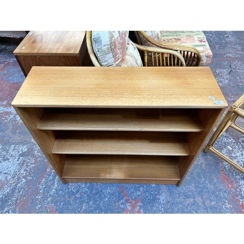 179 - A Turnidge of London Ltd teak three tier bookcase