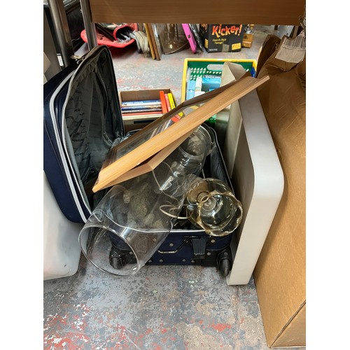 900 - A large collection of house clearance items to include leather gun case, boxed board games, ceramics... 