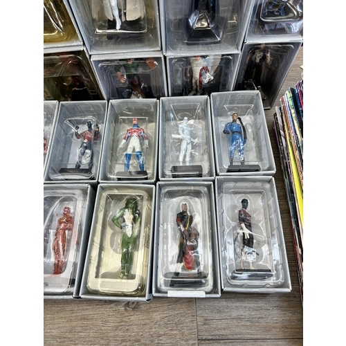 359 - A large collection of Marvel accessories to include approx. 49 boxed The Classic Marvel figurines wi... 