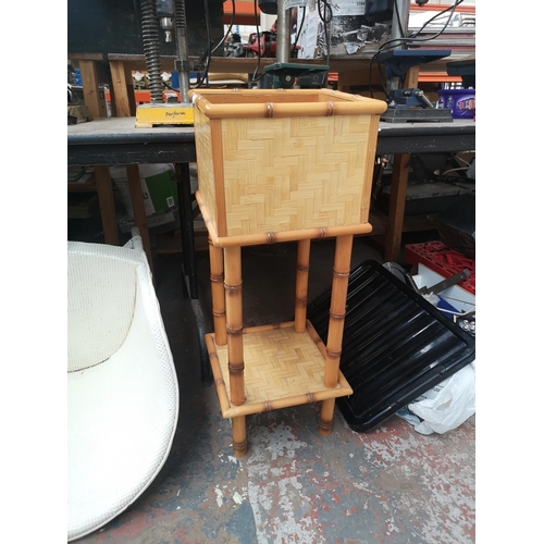 841 - A collection of house clearance items to include rattan and bamboo effect two tier jardiniere stand,... 