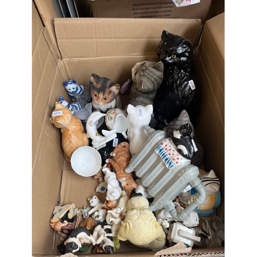 904 - A box containing ceramics and glassware to include Country Artists Inspirations cat figurine, cat on... 