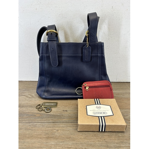 425 - Two Coach items, one blue leather women's handbag - no. E7M-4157 and one boxed red leather purse - n... 