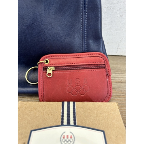 425 - Two Coach items, one blue leather women's handbag - no. E7M-4157 and one boxed red leather purse - n... 