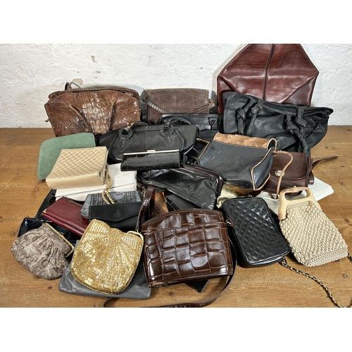 432 - A collection of women's bags to include early 20th century crocodile skin, Radley etc.