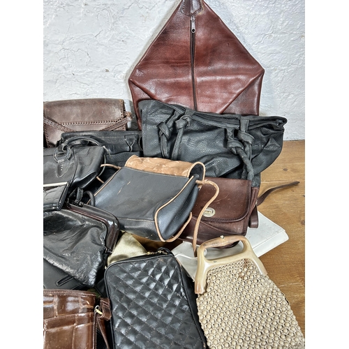 432 - A collection of women's bags to include early 20th century crocodile skin, Radley etc.