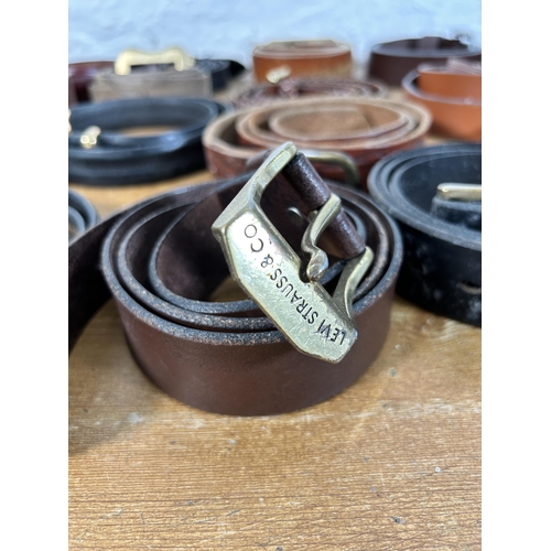 434 - A collection of men's leather belts to include Levi, Ralph Lauren, Coach etc.