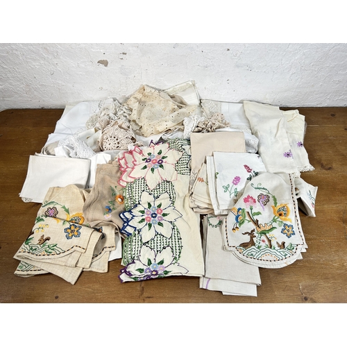 435 - A collection of embroidered and lace table linen