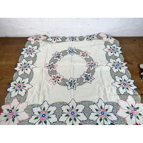 435 - A collection of embroidered and lace table linen