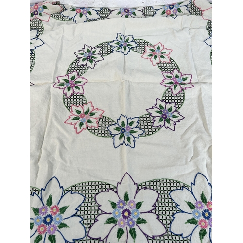 435 - A collection of embroidered and lace table linen