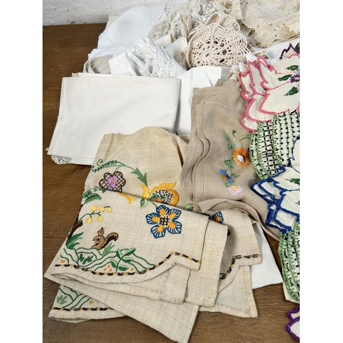 435 - A collection of embroidered and lace table linen