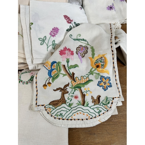 435 - A collection of embroidered and lace table linen