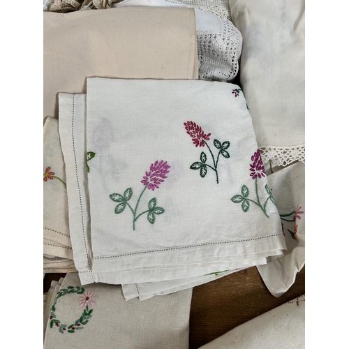 435 - A collection of embroidered and lace table linen