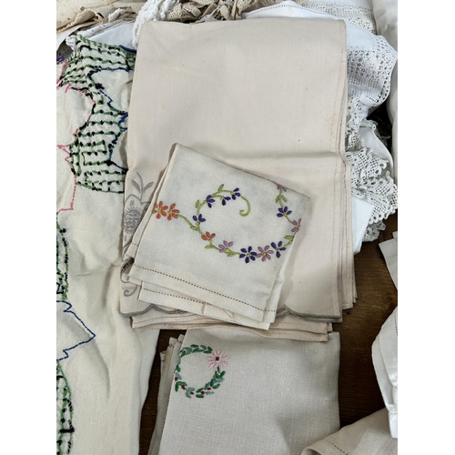 435 - A collection of embroidered and lace table linen