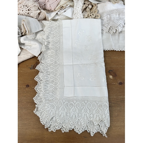 435 - A collection of embroidered and lace table linen