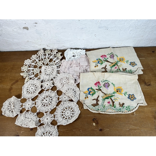 435 - A collection of embroidered and lace table linen