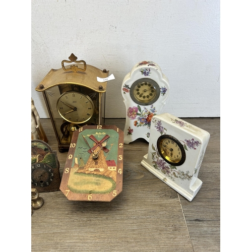 519 - A collection of early/mid 20th century clocks to include German hand painted porcelain, Schatz 400 e... 