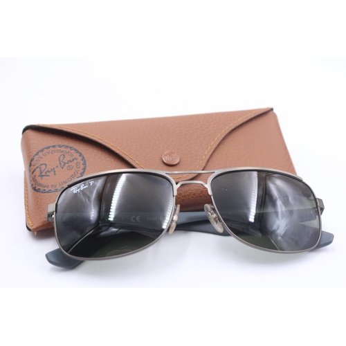 2430 - A pair of cased Ray-Ban grey sunglasses