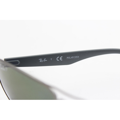 2430 - A pair of cased Ray-Ban grey sunglasses