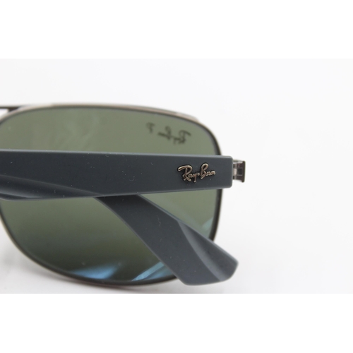 2430 - A pair of cased Ray-Ban grey sunglasses